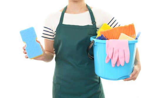 Office cleaning professional sanitizing a modern reception area
