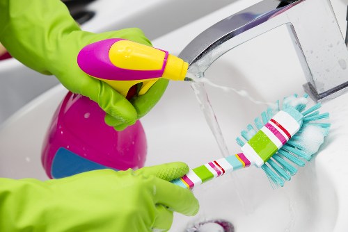 Professional upholstery cleaning of a sofa in a modern living room