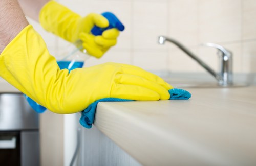Professional cleaner maintaining shared hallway