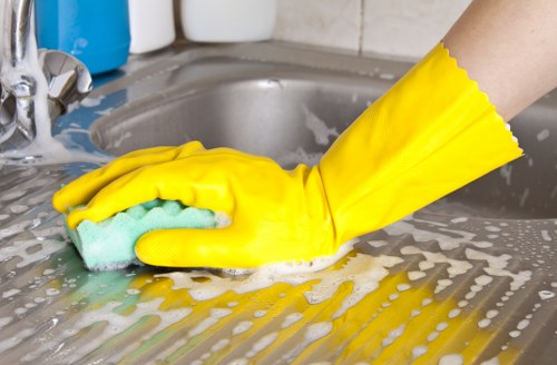Cleaner disinfecting bathroom surfaces during Airbnb turnover cleaning
