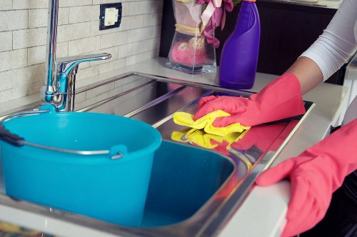 High-touch office surfaces being disinfected for workplace hygiene